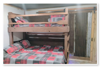 A bedroom in one of our cabins